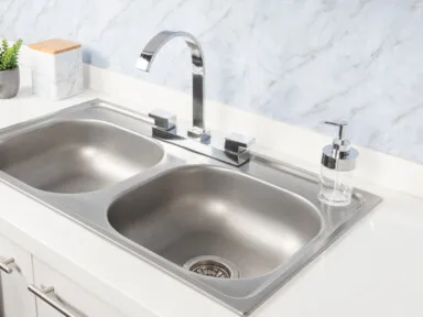 Close-Up Double Basin Kitchen Sink and Faucet without water stains