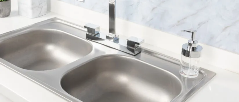 Close-Up Double Basin Kitchen Sink and Faucet without water stains