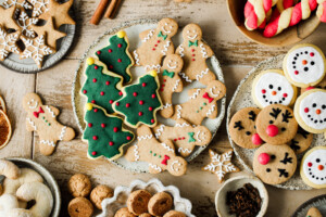 Top view of assorted Christmas cookies on festive table. Conserve water at home with batch cooking.